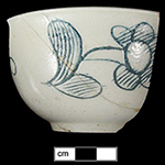 Scratch blue cup with floral motif, recovered from cellar hole dating to mid-18th century., Lots 1 and 2.